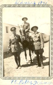 Sidney Fishman on horseback with two other soldiers. Caption on back: "Troop 'C', 1st Training Squadron, Ft. Riley, KS. Approx April 1941. All are Jewish."